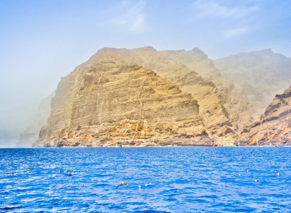 view of los gigantes, the huge rocks at the west coast of tenerife, from a boat