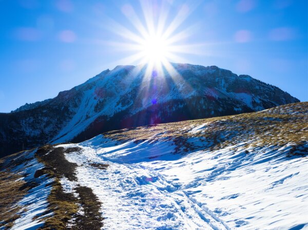 Sunstar over the schneeberg (2070 m) on a winter's day, with a little snow