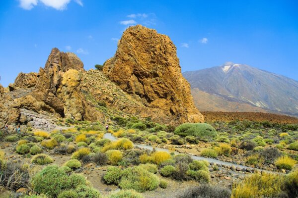 Rocky volcanic landscape, pico del teide volcano in the background