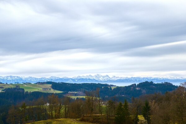 View of the mühlviertel and the snow capped alps from rechberg, upper austria